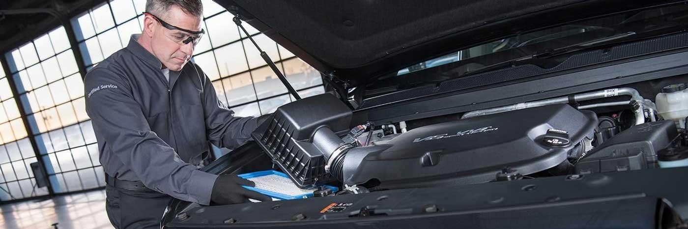 man working on car